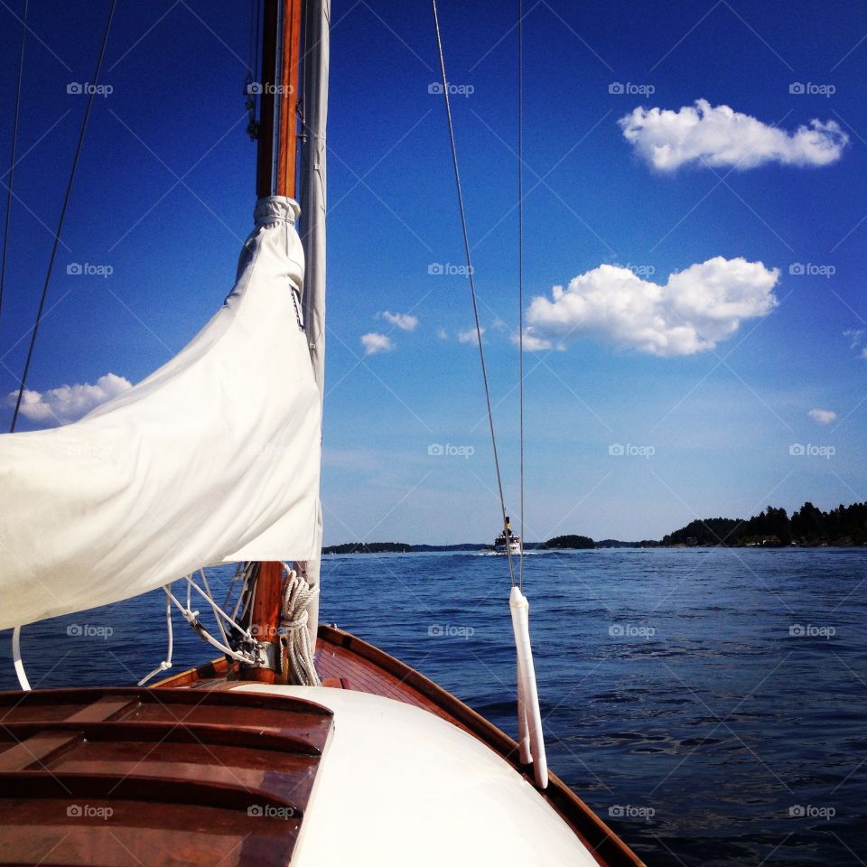 Going out on the boat. Out on the boat on a beautiful day in the archipelago of Stockholm. It's a Nordic cruiser 5 1/2 wooden sailboat. 