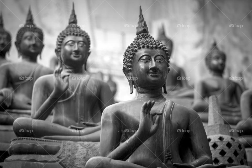 Many buddhas in the temple in Sri Lanka