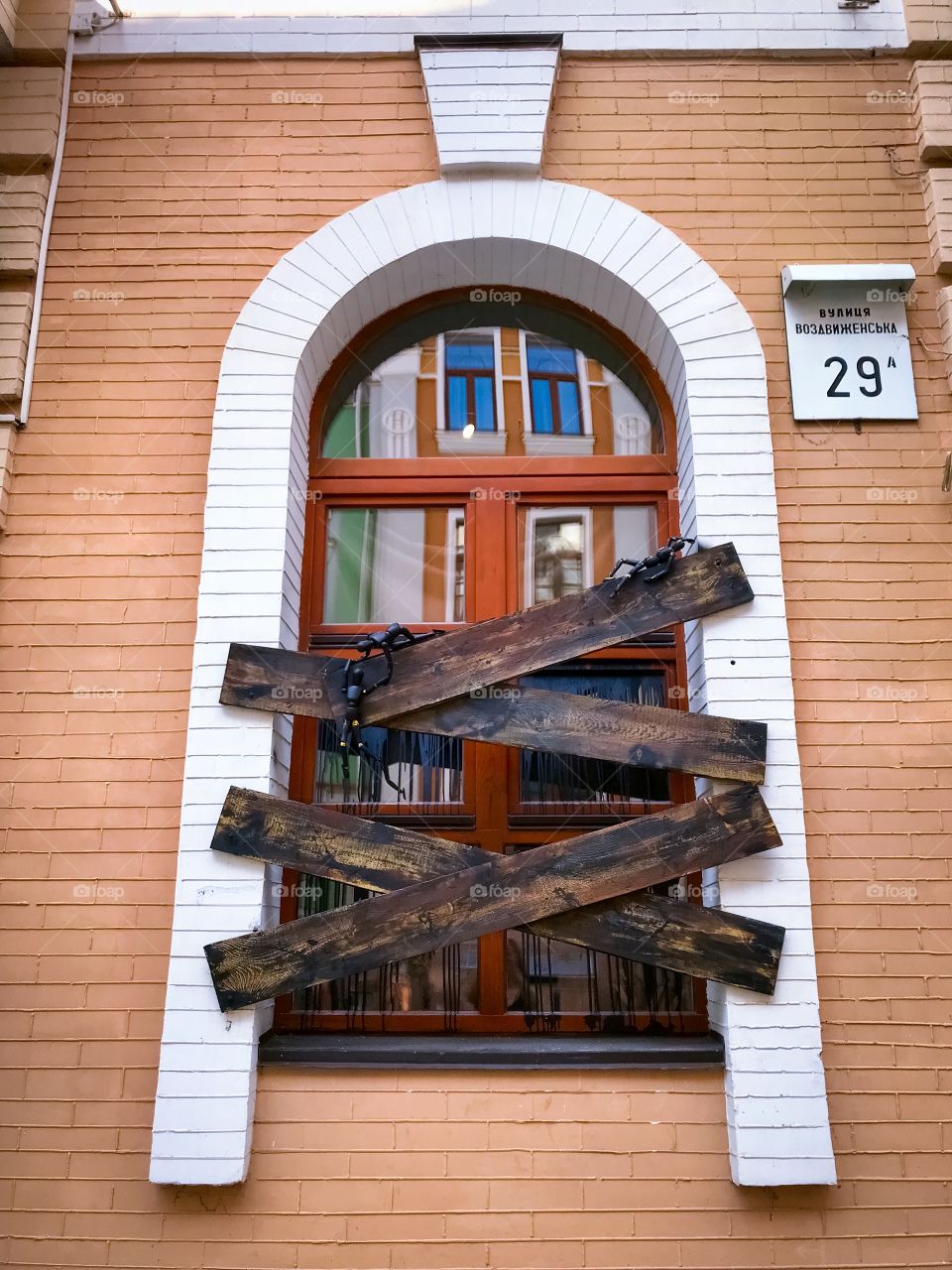 An artistic window of a building in the old town Kiev 