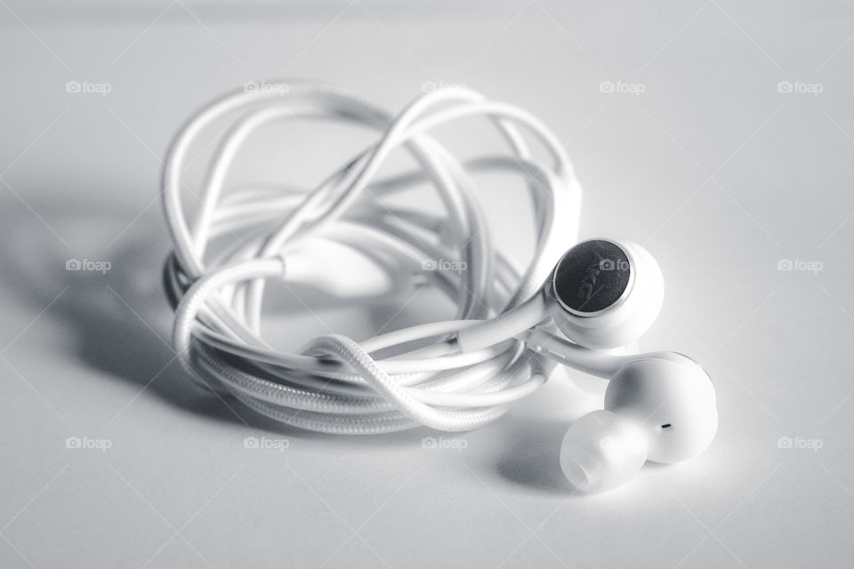 White headphones on the white background