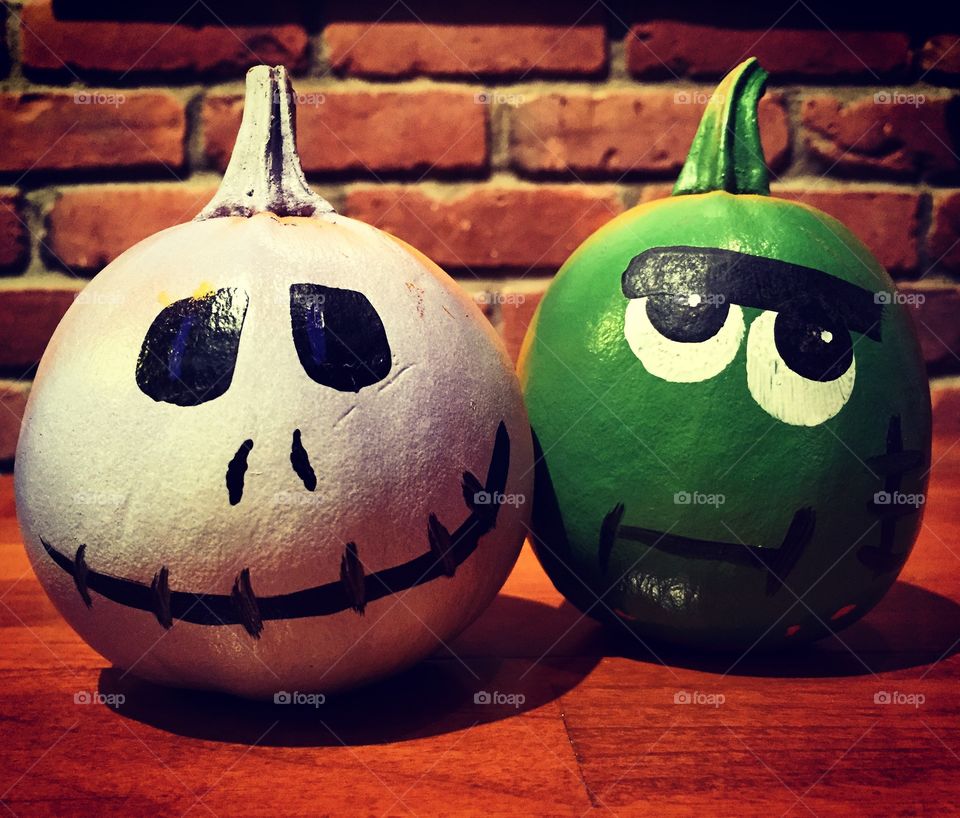 Two painted Halloween pumpkins