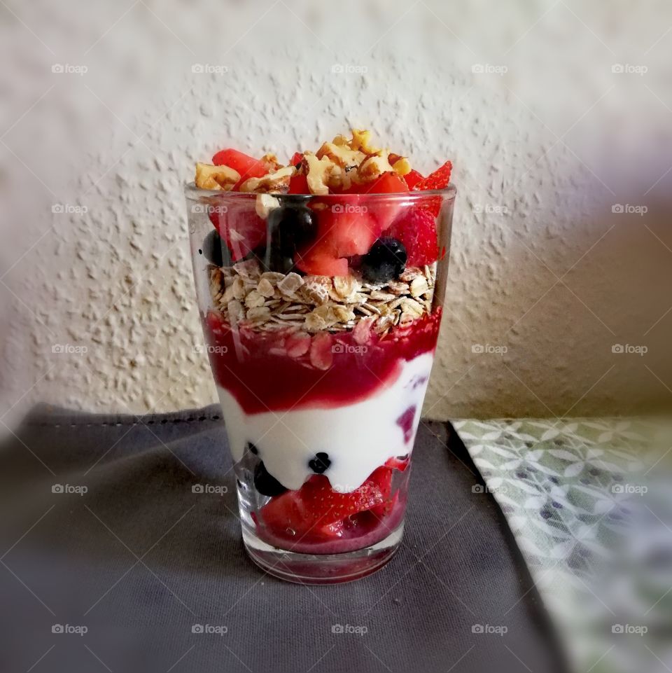 Glass with berries, oats and yoghurt