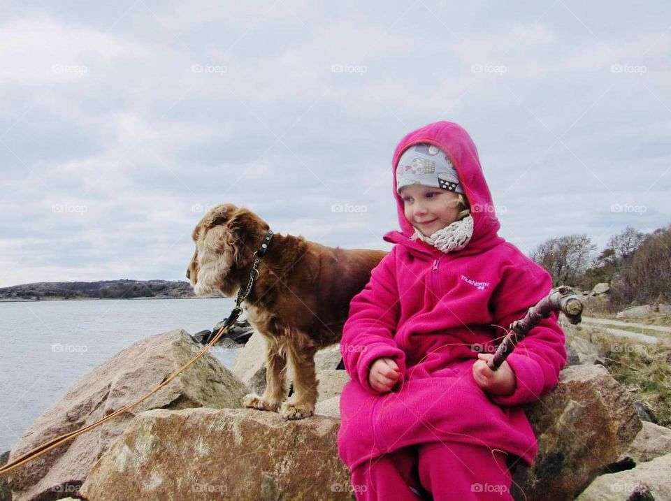 A little girl with a dog 