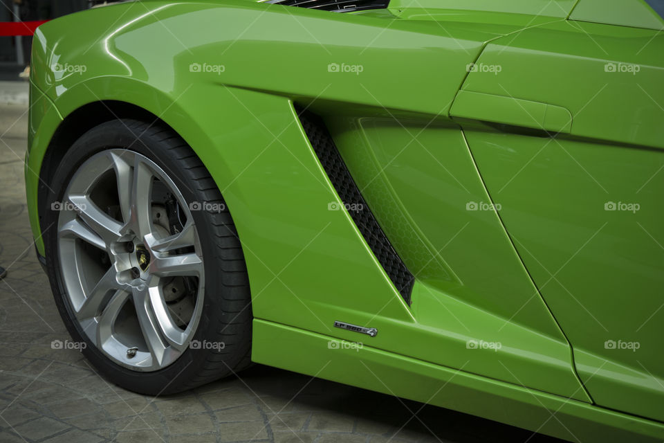 back wheel close up of green Lamborghini Gallardo squadra corse special edition coupe