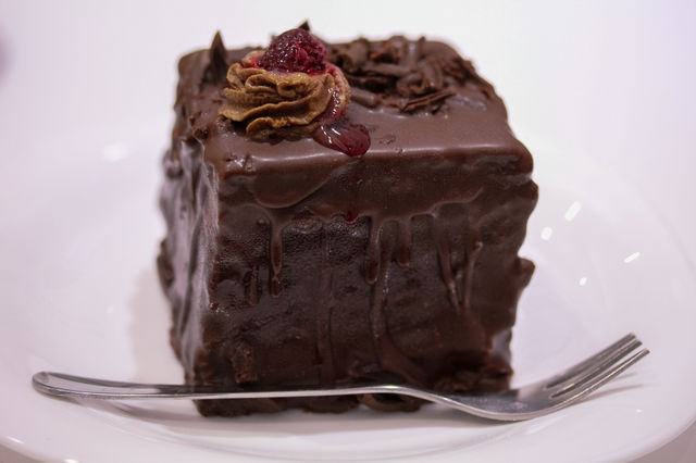 Chocolate mousse with raspberries on a white plate