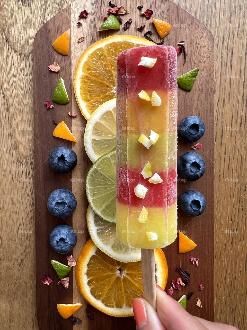 Summer treats, summer time, summer mood. Delicious juicy and freshly lollies and tasty fruits with blueberries. Good choice for hot summer days. Refreshing snacks.