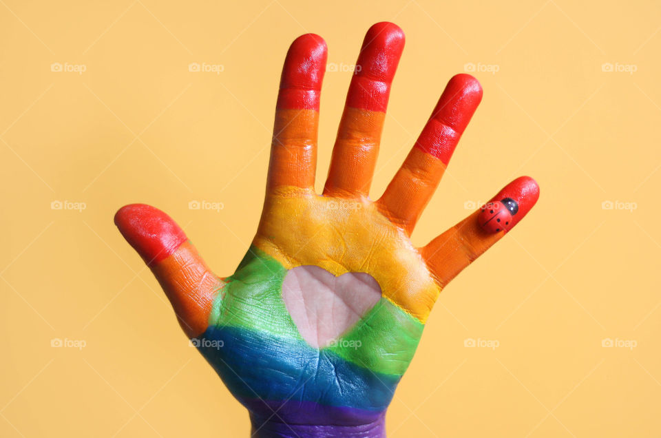 Colorful painted hand, heart shape, rainbow colors