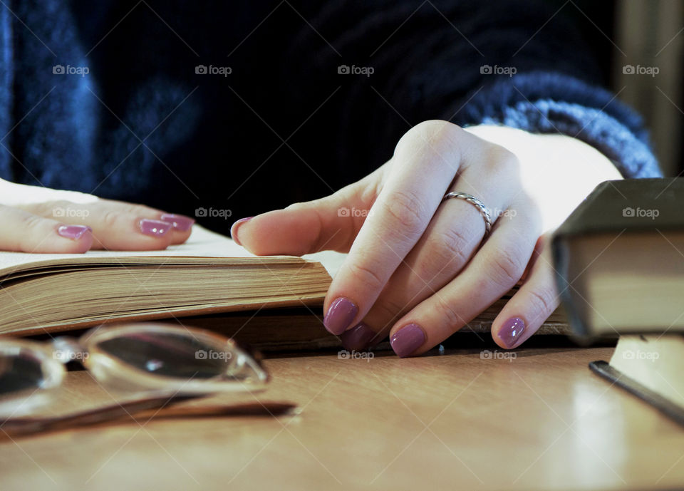 Girl leafing through a book