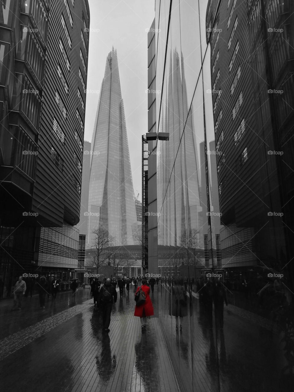 Wet London with the Shard and lady in red