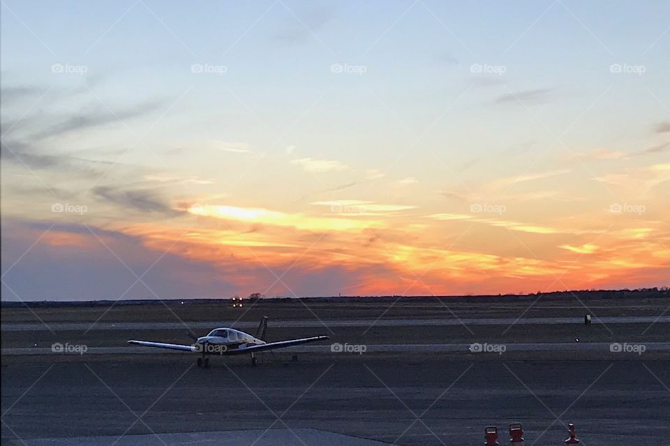 Beautiful Sunset Sky at Stillwater Oklahoma Regional Airport with Single Airplane