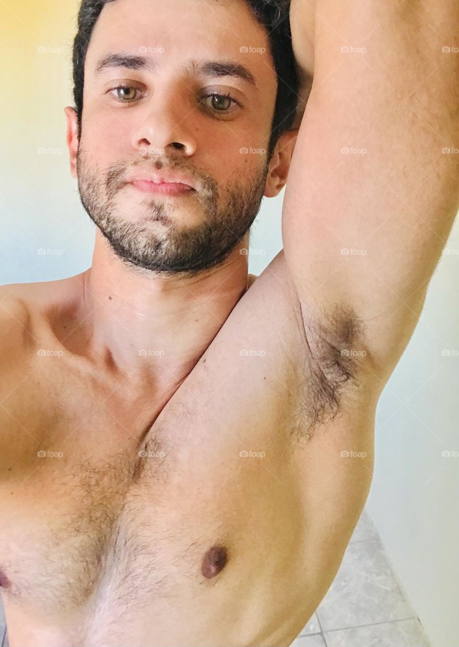 strong man showing his arm and chest