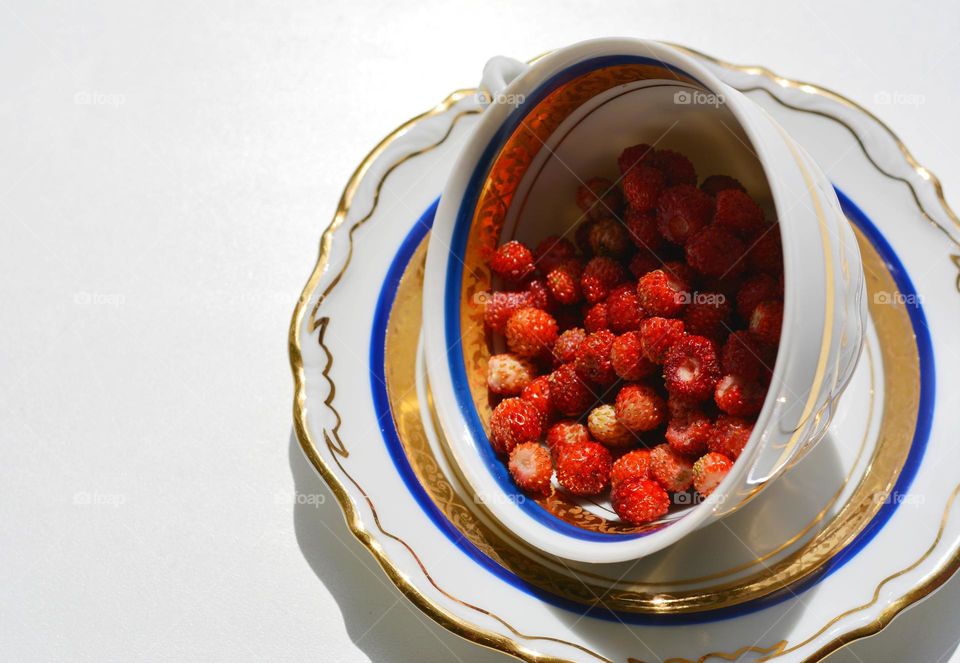 cup with wild strawberry healthy living