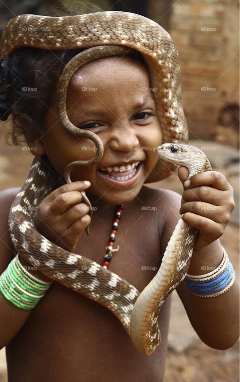 Young boy with snake