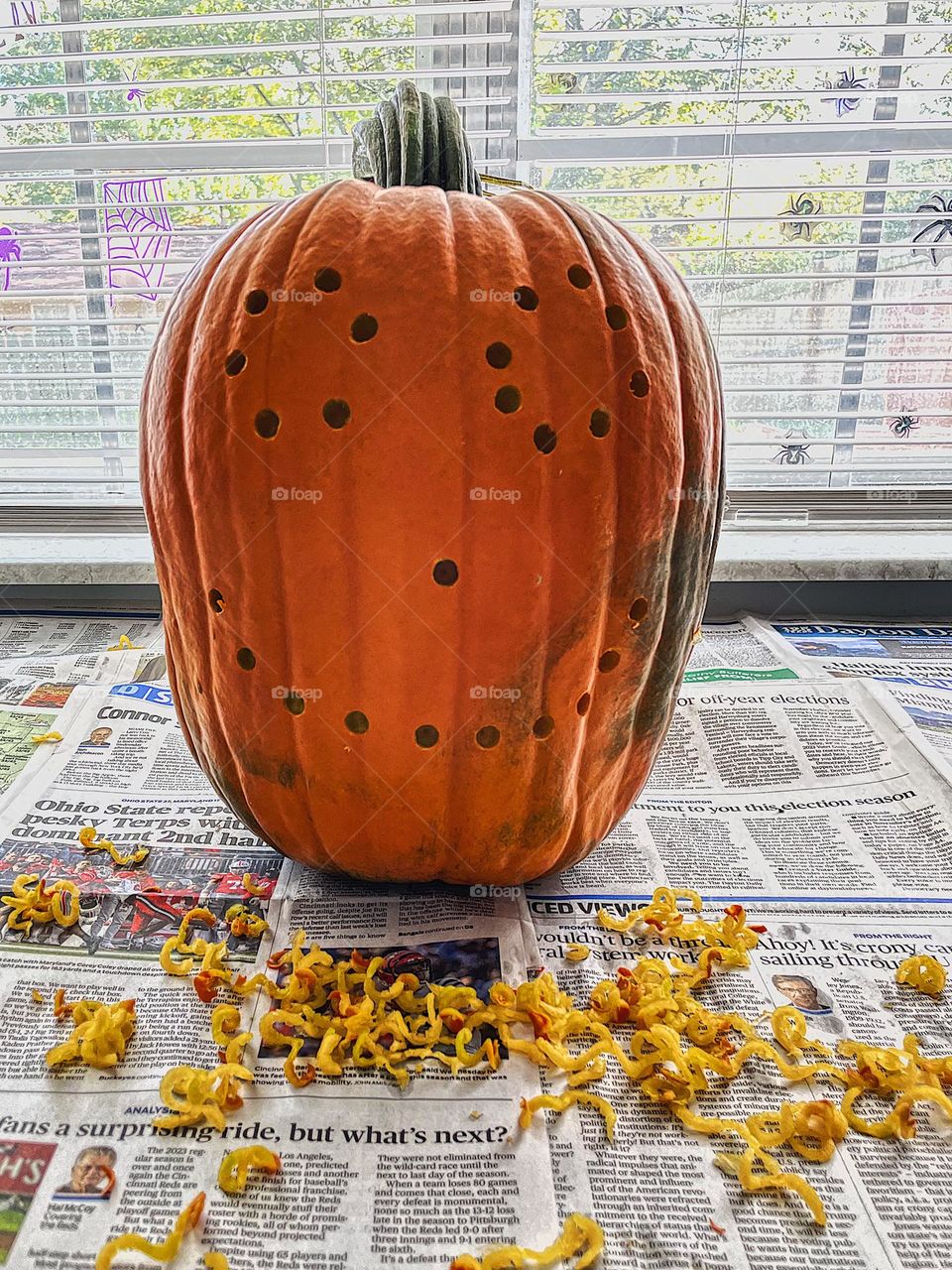 Creative carving of pumpkins, drilling holes in pumpkins, making a pumpkin face with a squirrel feeder, filling pumpkins with peanut butter, faces on pumpkins, making jack o lanterns