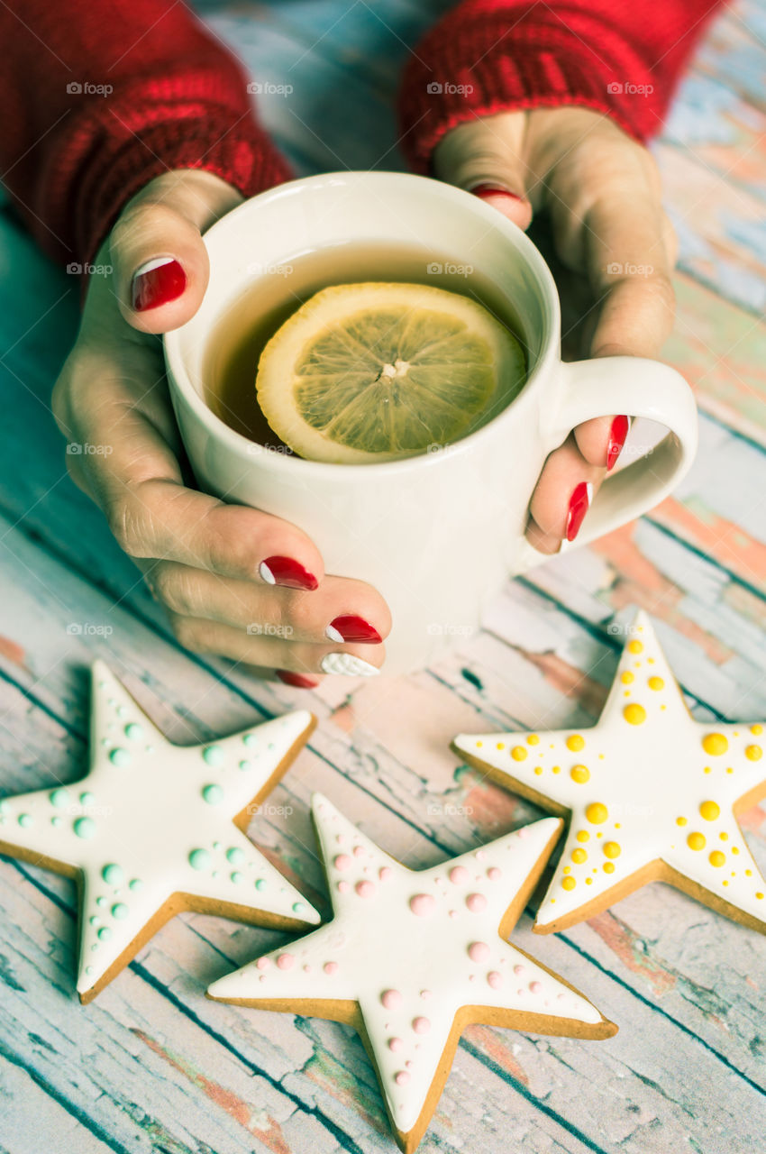 woman hand with cup of tea