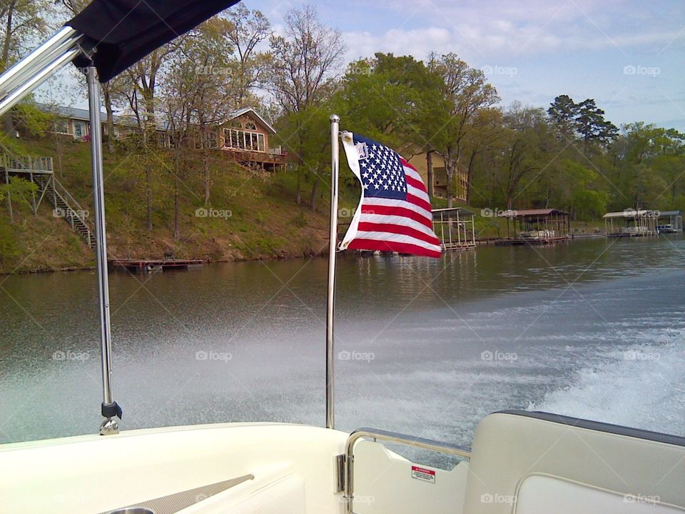 The beautiful American flag out on the lake