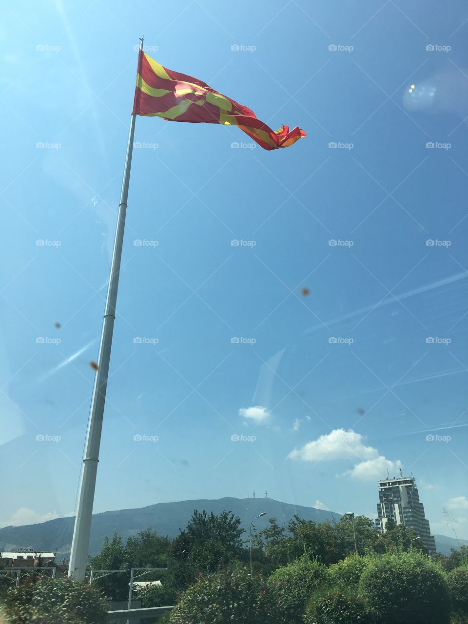 Macedonian flag above city of Skopje
