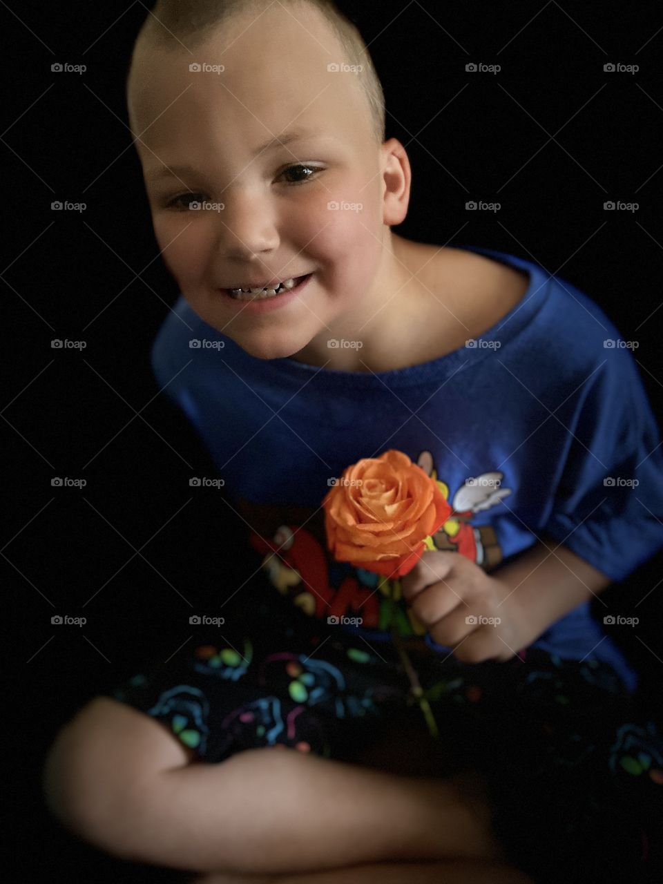 My autistic adopted special needs son. Loves to smile for the fun. he shows love how you show love the innocence of a child is the best love