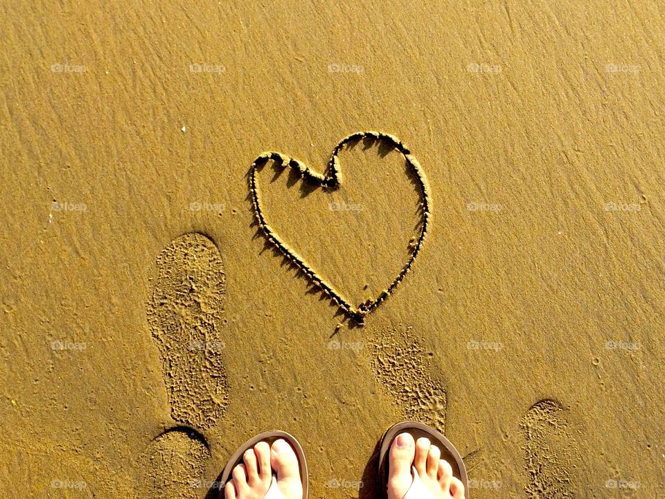 Heart shape on sandy beach