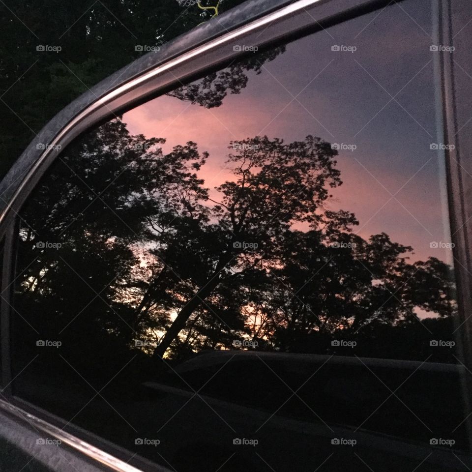 Sunset reflection through car window