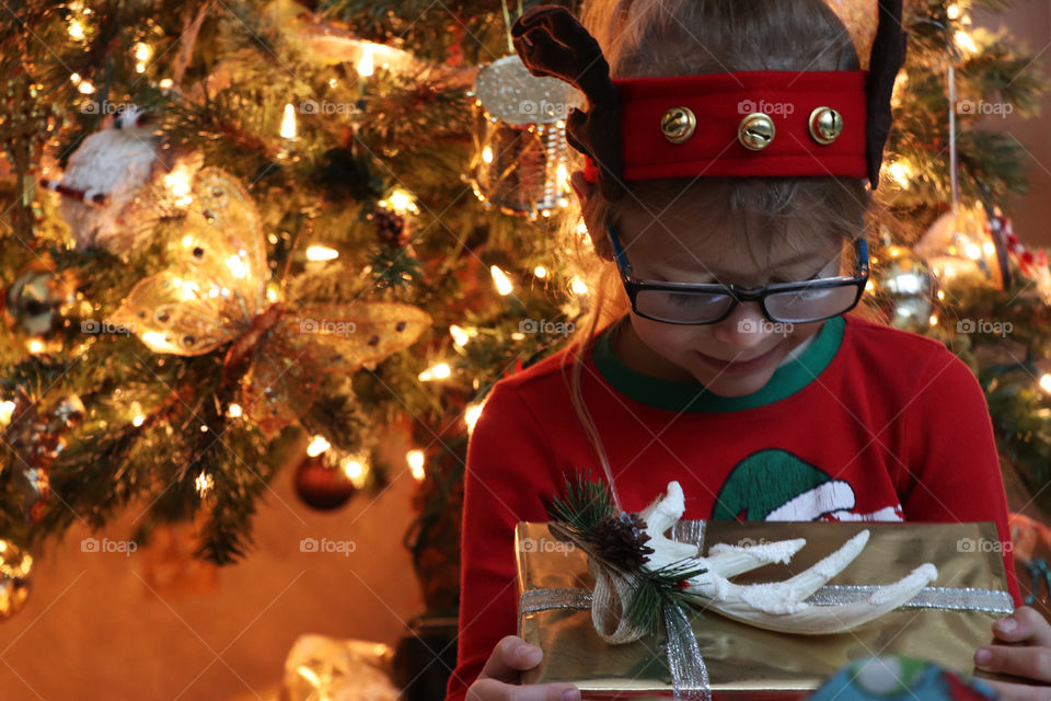 Child under the Christmas tree