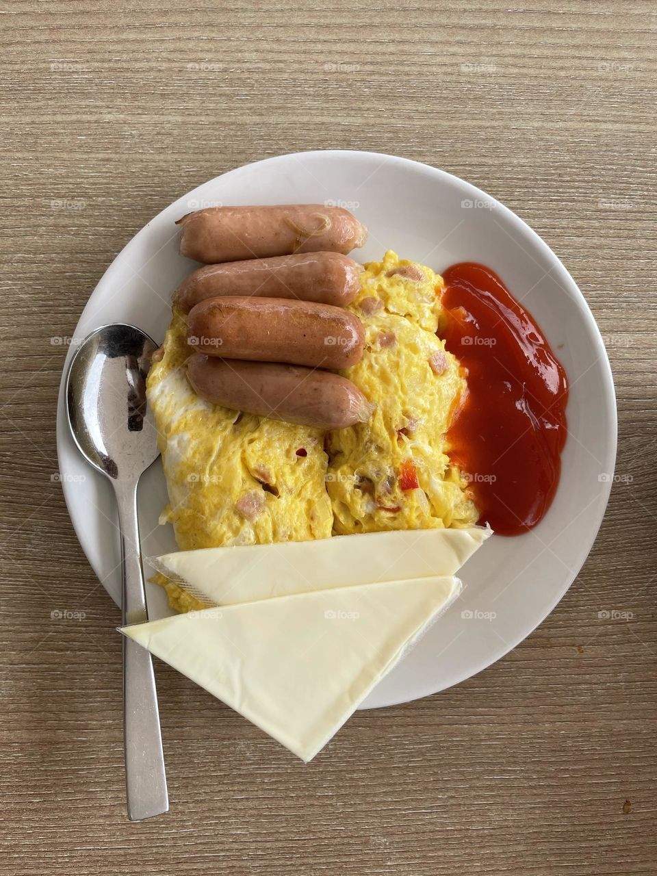 Fun breakfast with omelette and sausage