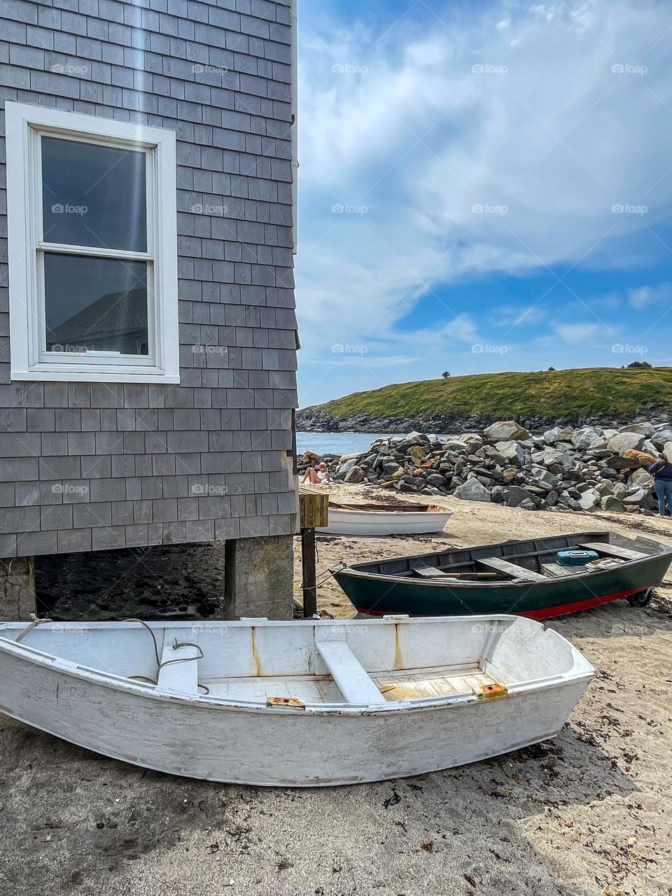 “Fish Beach, Monhegan Island.”  Dories sit on the sand in front of a fish shack on this amazing island.