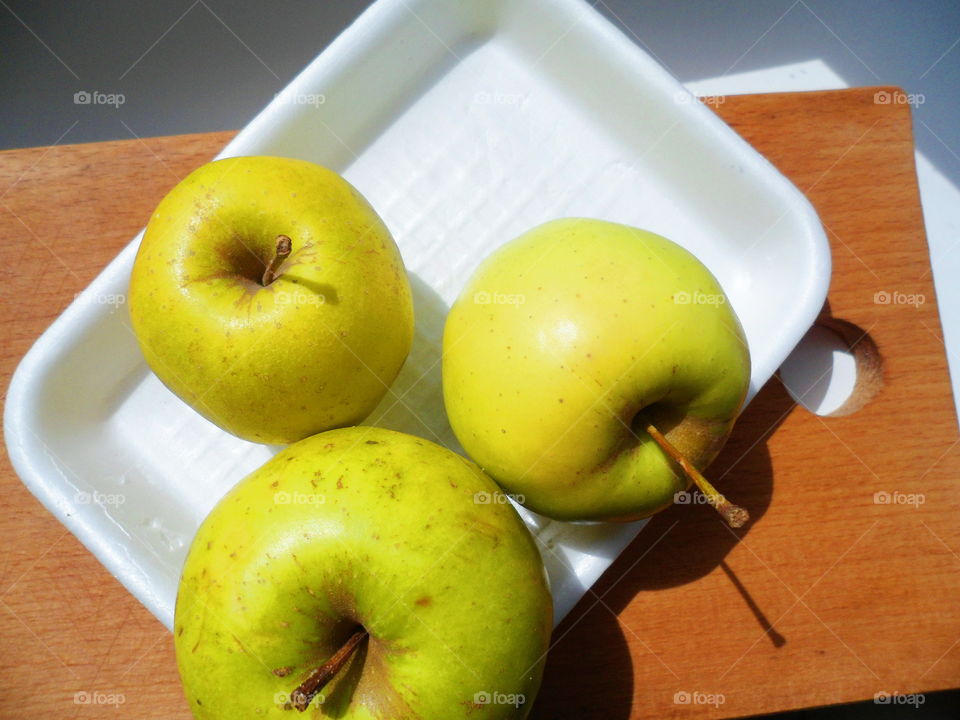 Three green apples