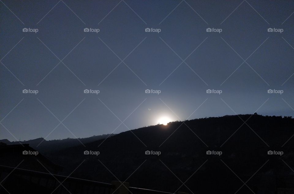 The sun going behind the mountains