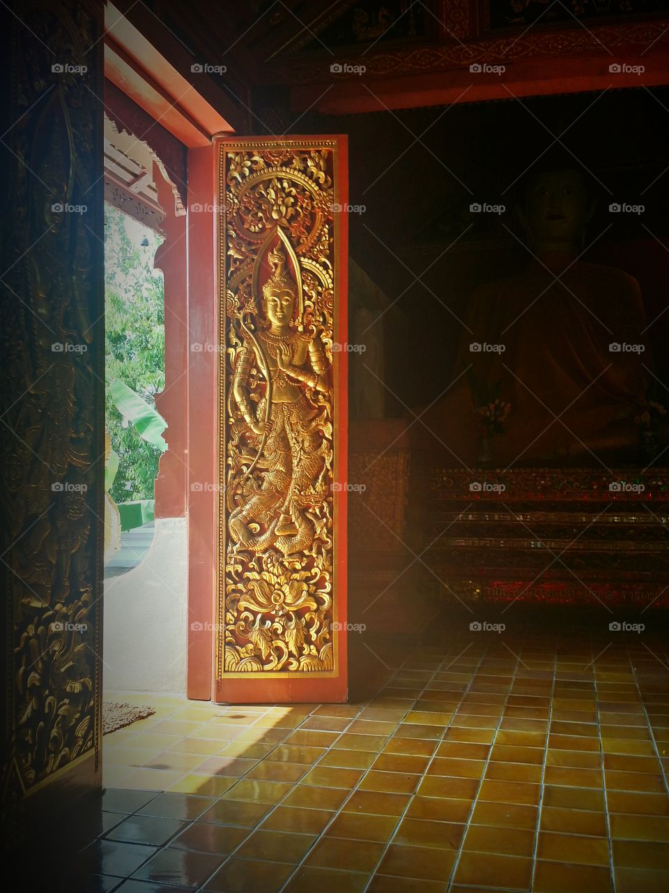 Wood door carving in Wat Thai. The art of Thai style.