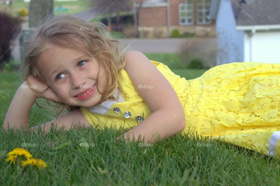 My five-year-old little girl gazing off into the distance as I'm trying to shoot her picture. 