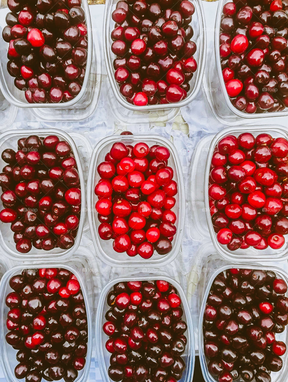 Sweet Red cherries in the plastic trays.