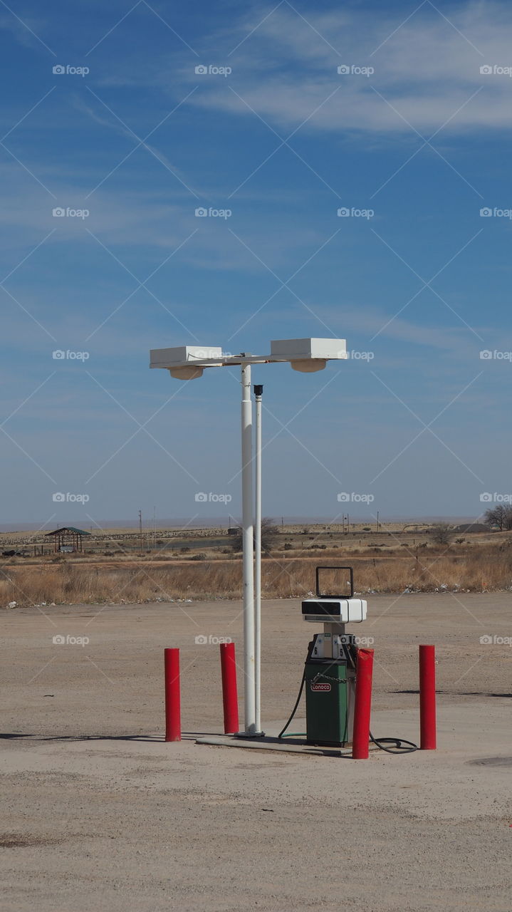 Isolated gas pump. Fuel gas pump desertic scene