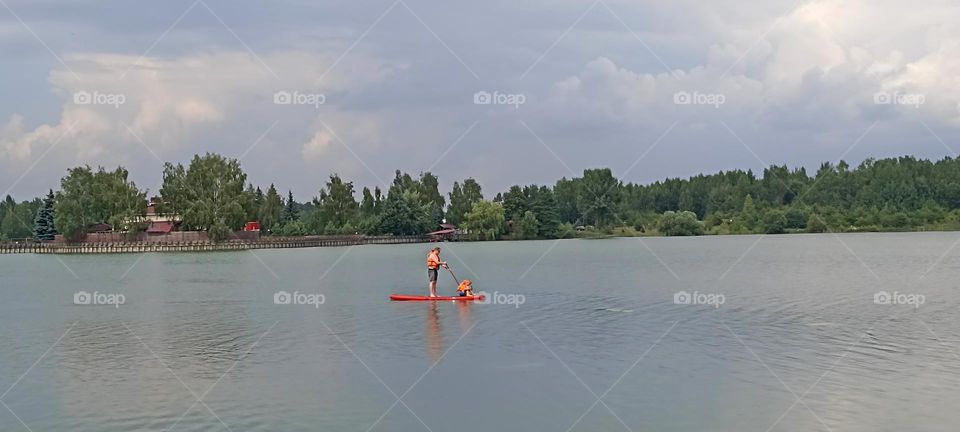 family father and son on a lake summer activities