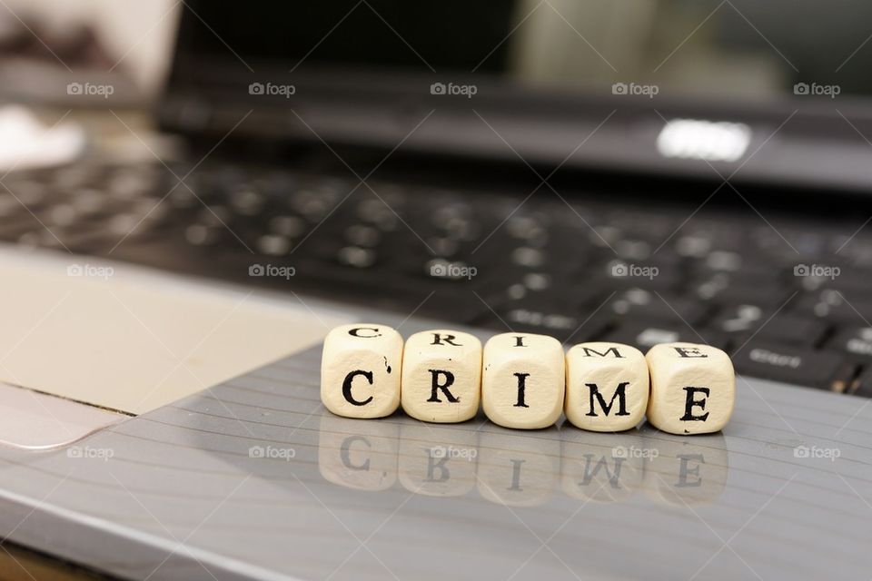 Cyber crime cubes on laptop
