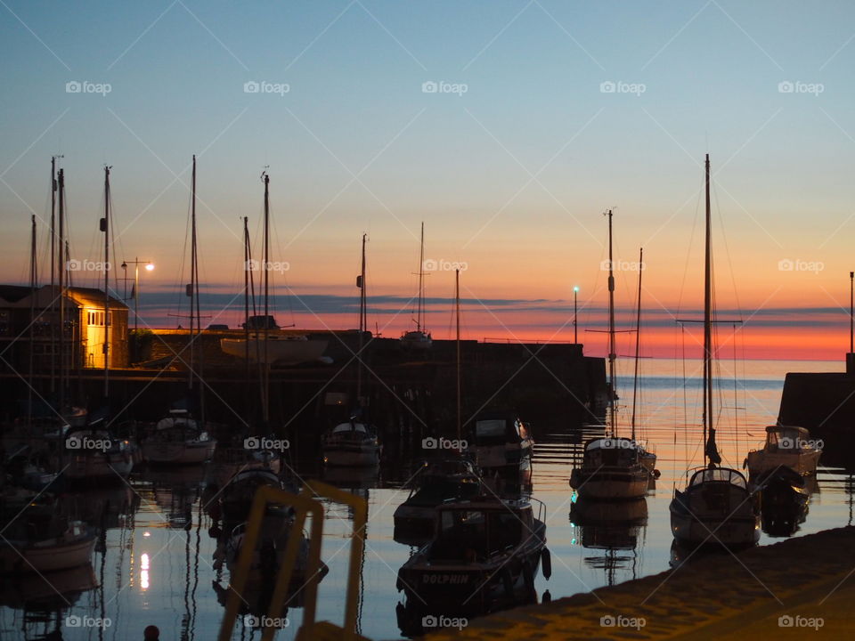 Aberaeron at Sunset looking out over the harbour and boats