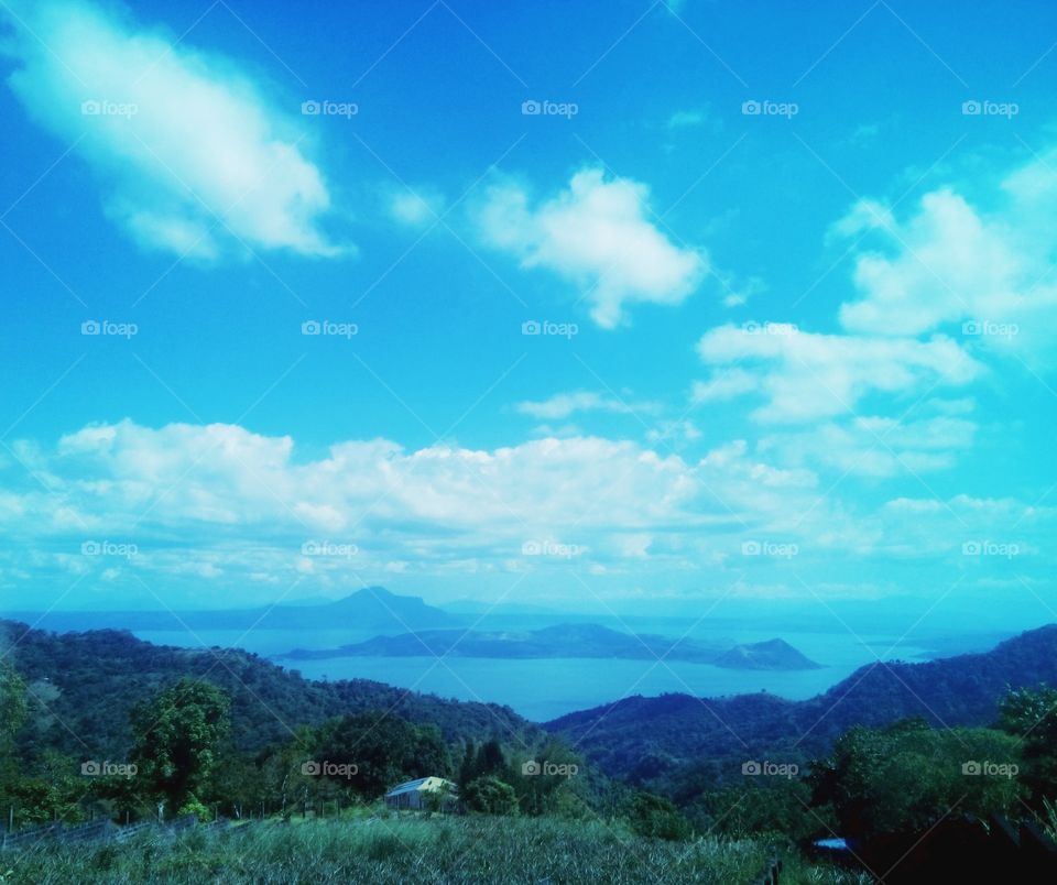 Active Taal volcano and lake. Peaceful blue sky and cold weather.