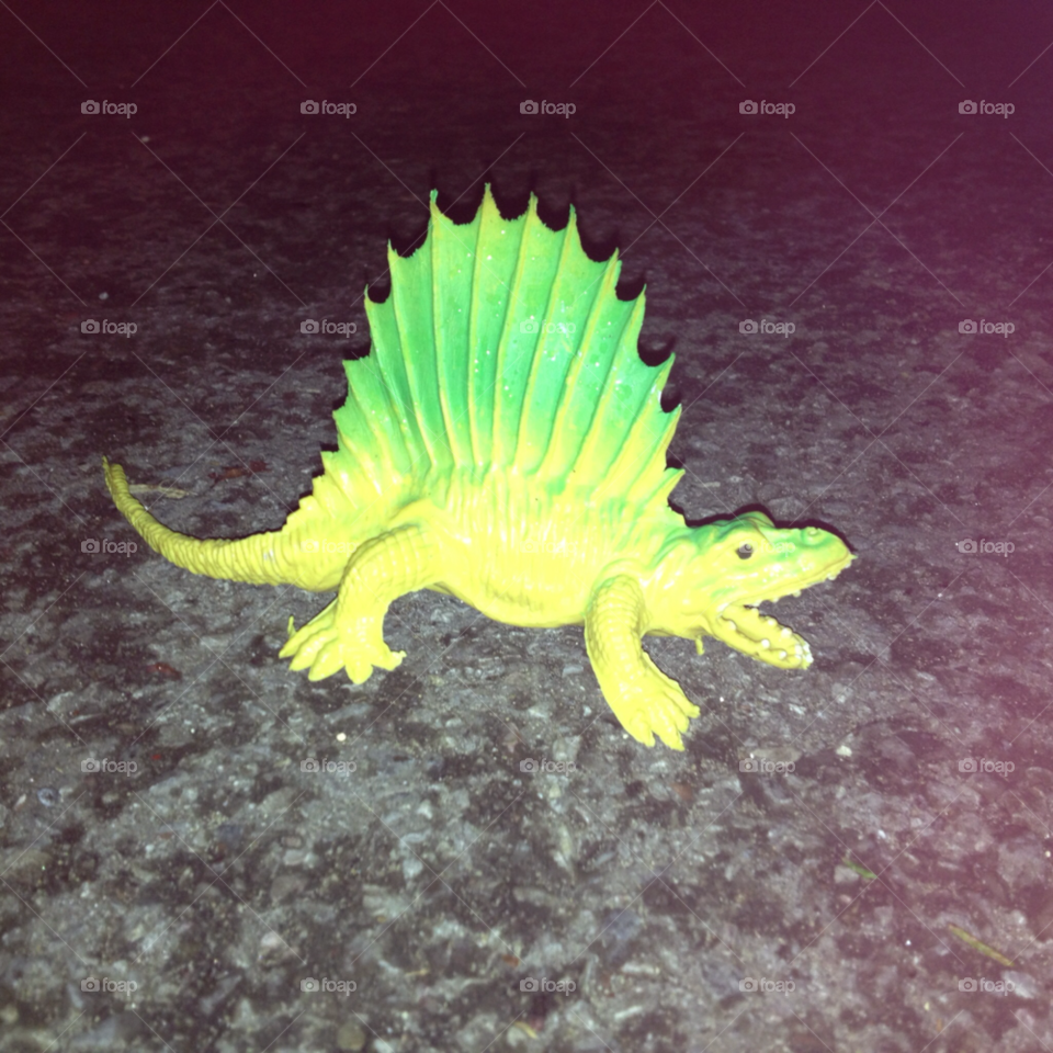 green toy dinosaur bright by cayk