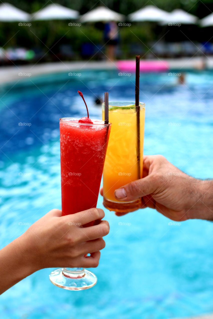 refreshing drink by a pool