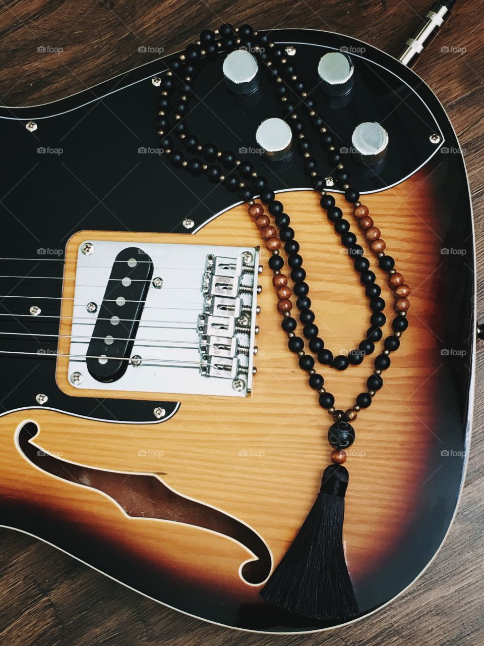 Mala beads on guitar 