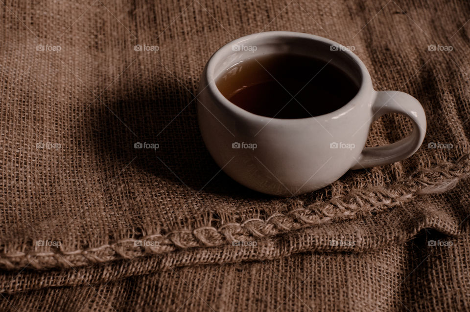 White mug filled with black coffee