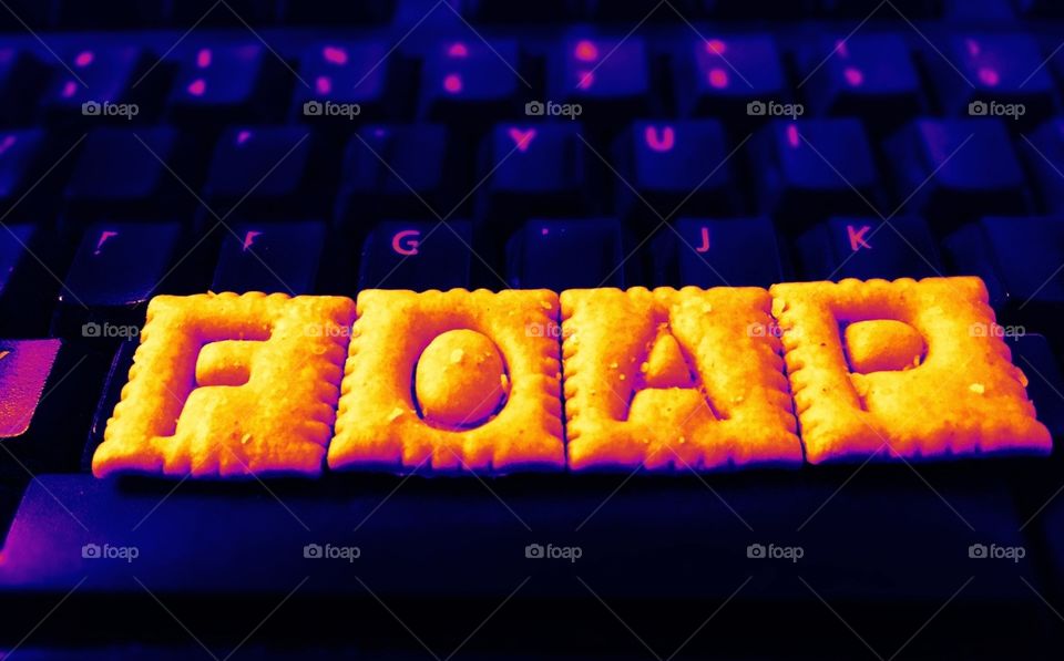 FOAP spelled In Cheezits on a black keyboard 