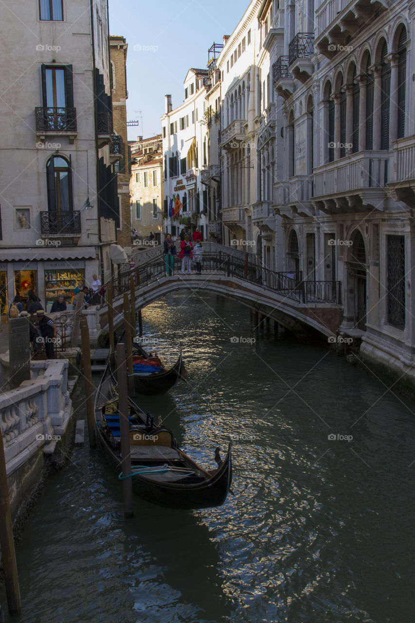 Canal, gondolas, and bridge in Venice, Italy. 