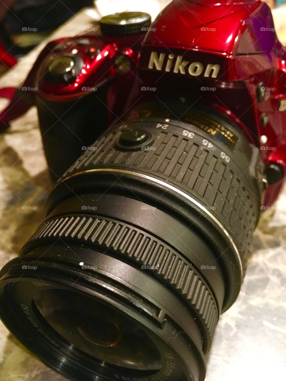 Nikon camera D3300 in red. With a. Nikkor lens