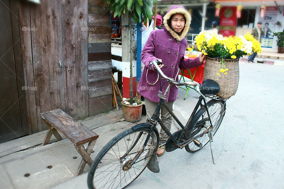 Enjoy in the morning.. Woman enjoy with bicycle in the morning on Winter.