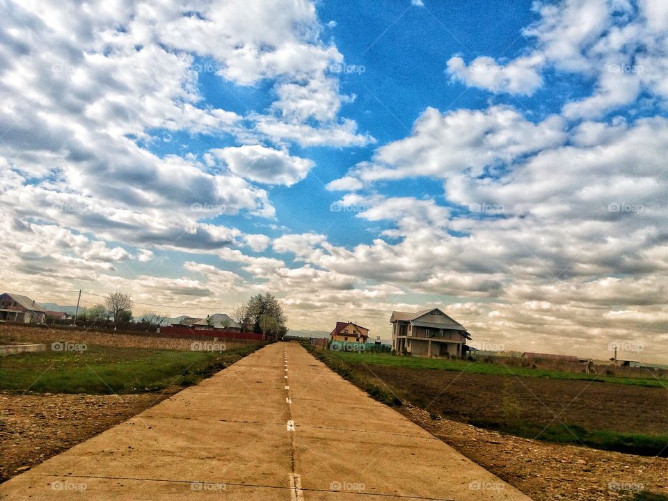 Beautiful landscape with a blue sky full with fluffy clouds.