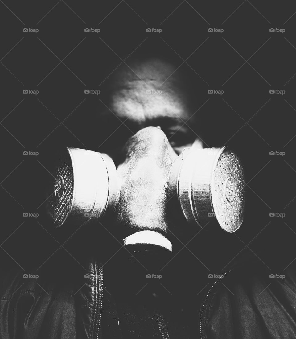 Black and white man portrait on gas mask