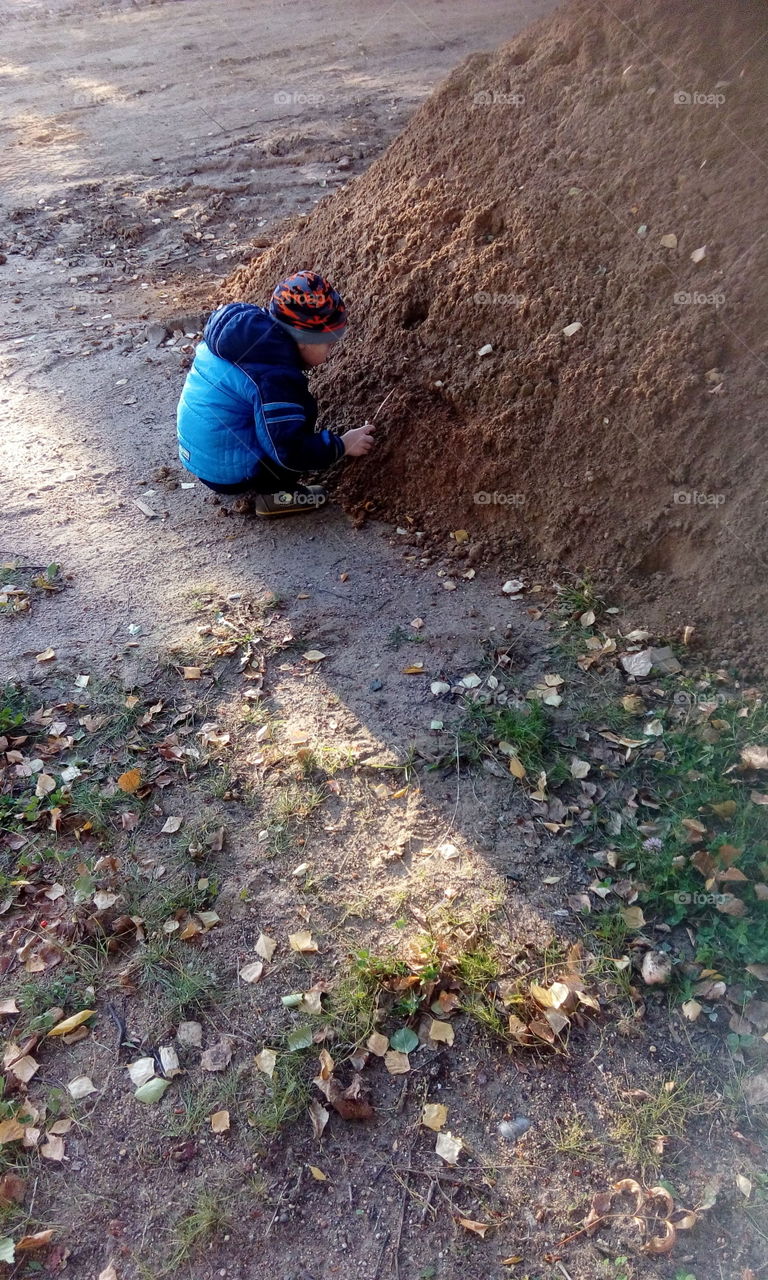 boy play with sand