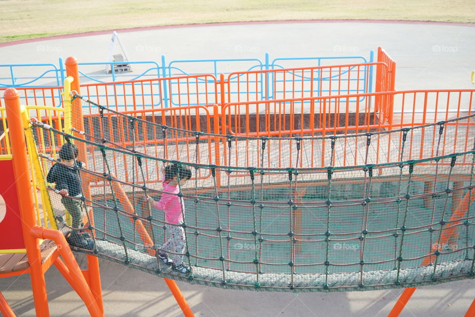Japanese girl walking on obstacles playground