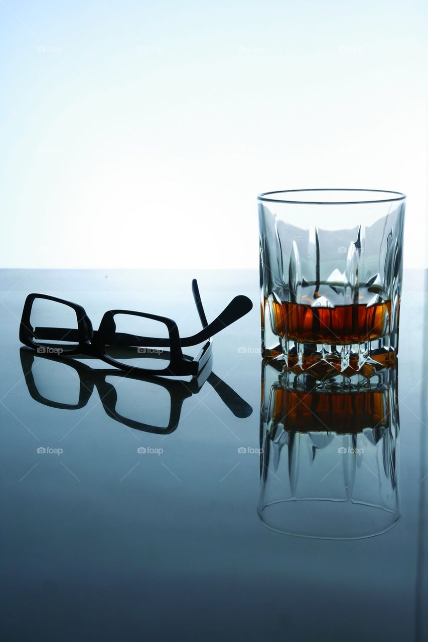 alcoholic drink and a pair of eyeglasses